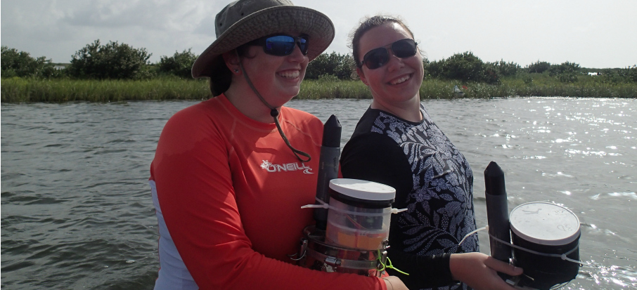 Erin Keller '16 and Caffray, holding oxygen chambers that they designed and built