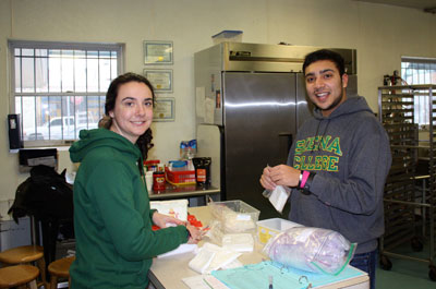 Students working at the St. Francis Inn. Photo Courtesy of Fr. Dennis Tamburello '75, O.F.M., Ph.D.