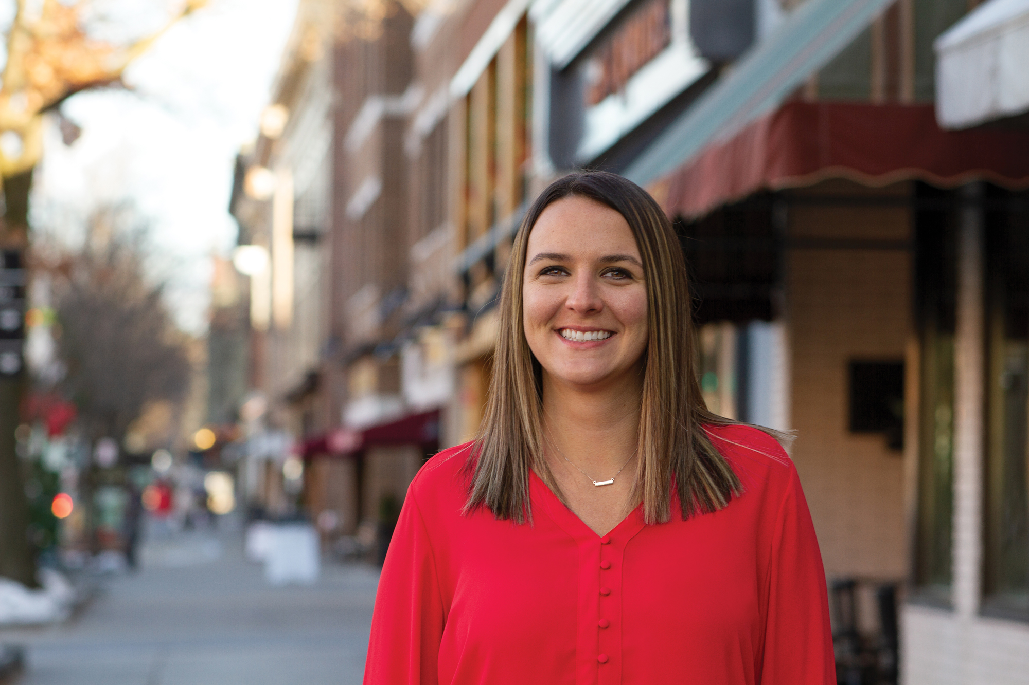 Lizzie Schlegel headshot in downtown Saratoga