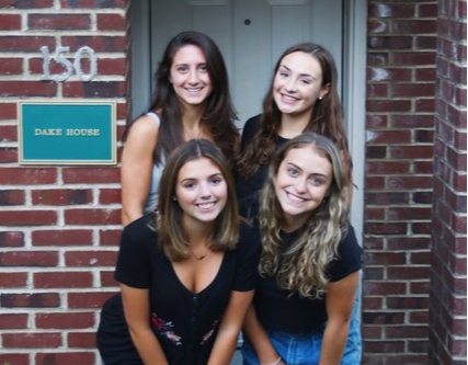 Siena's Make a Wish girls pose in front of their Townhouse