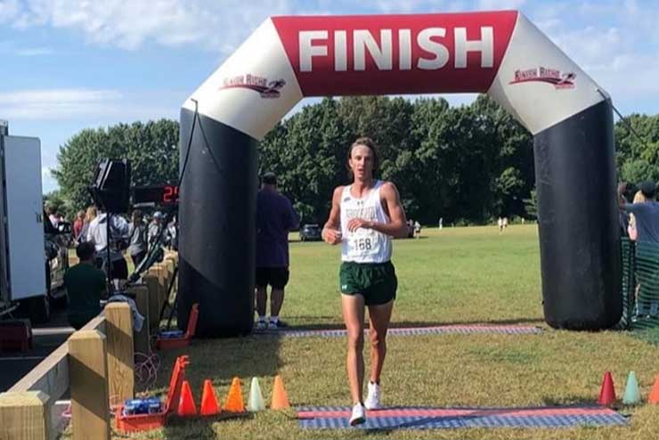 Olden running a race over the finish line