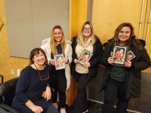 Erika Krouse and Siena Students Holding Krouse's Book